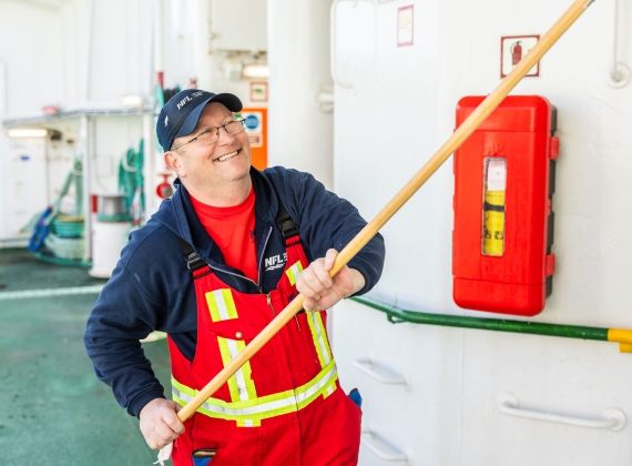 Crew members hard at work cleaning the exterior of the vessel. 