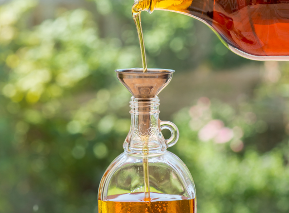 Maple Syrup being poured into a bottle