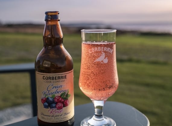 A bottle and glass of Corberrie Cider.